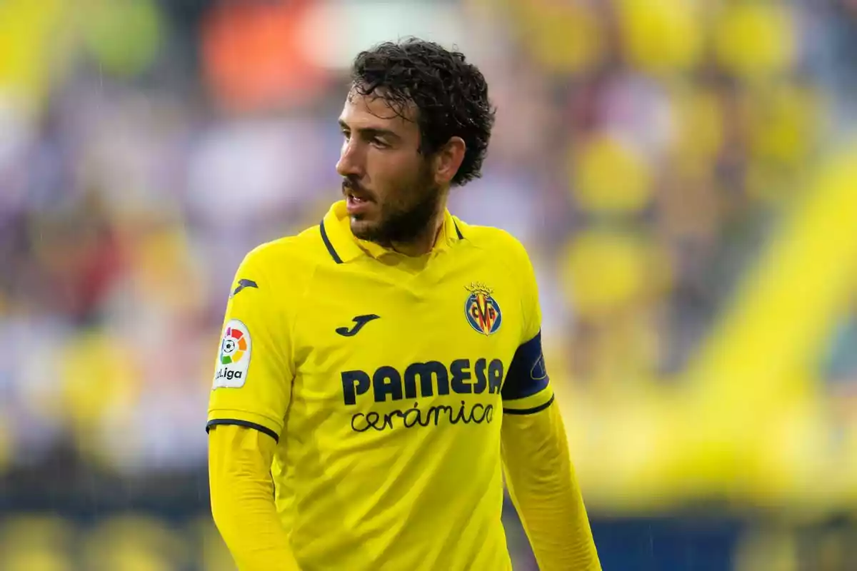 Football player in Villarreal yellow uniform on the field.