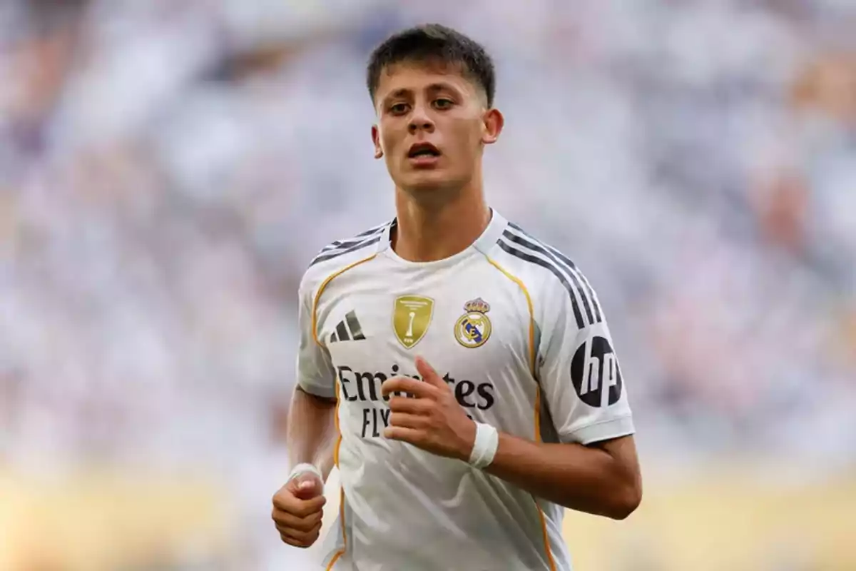 Young player in a white Real Madrid uniform during a match Young player in a white Real Madrid uniform during a match