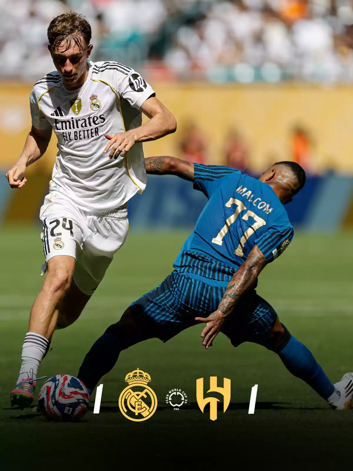 Un jugador del Real Madrid disputa el balón con un jugador del Al Hilal durante un partido de fútbol, ambos en acción sobre el césped con los logotipos de los equipos en la parte inferior de la imagen. Un jugador del Real Madrid disputa el balón con un jugador del Al Hilal durante un partido de fútbol, ambos en acción sobre el césped con los logotipos de los equipos en la parte inferior de la imagen.