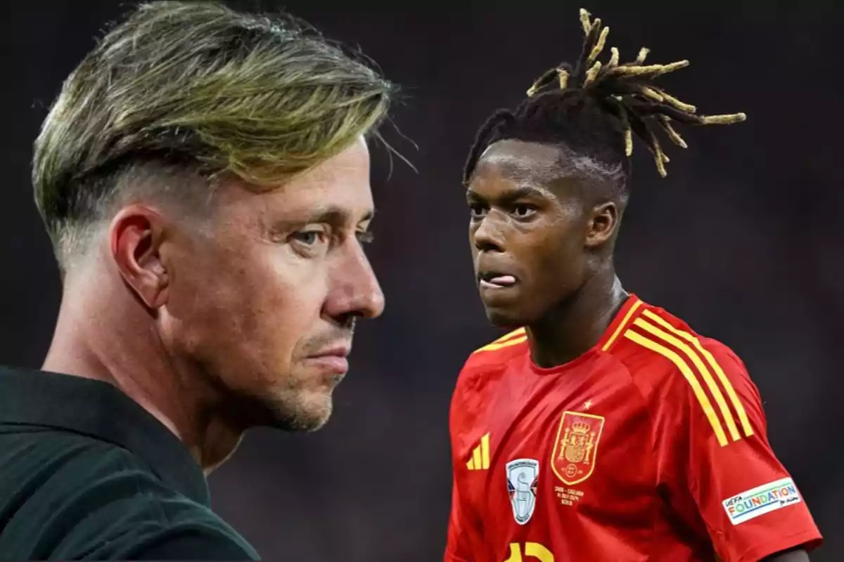 A soccer coach looks on thoughtfully while a player in Spain’s red national team uniform appears in the foreground during a match.