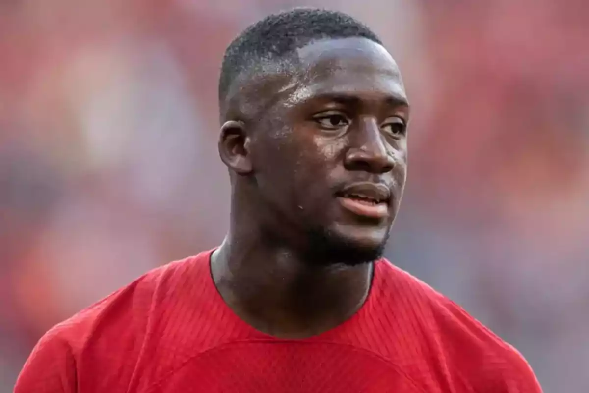 Soccer player wearing a red jersey during a match Soccer player wearing a red jersey during a match