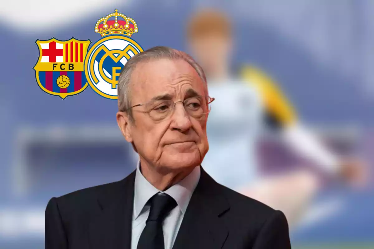 Hombre de traje con expresión seria al frente de los escudos del Barcelona y Real Madrid