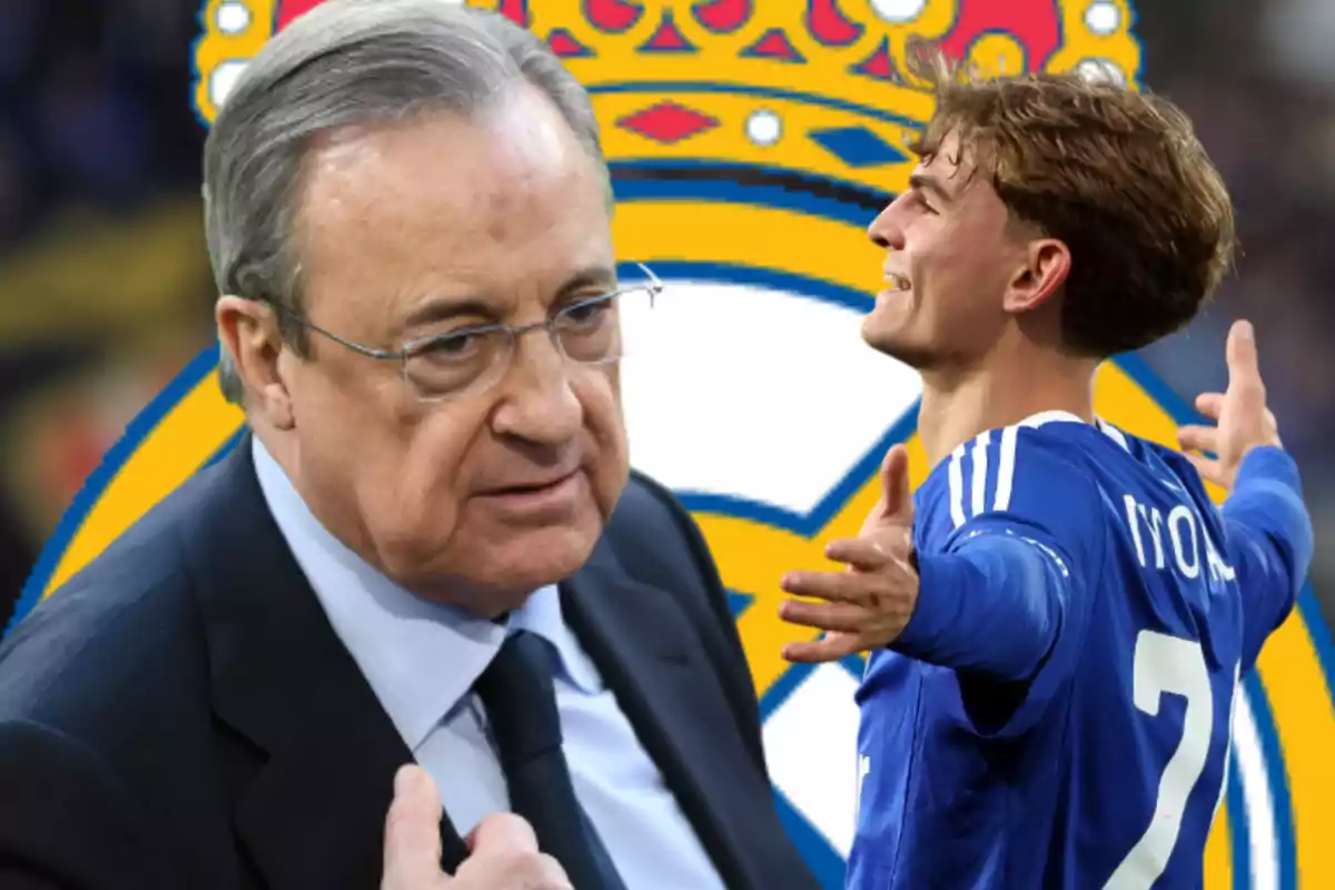 Hombre de traje y gafas junto a un futbolista celebrando con los brazos abiertos frente a un escudo grande del Real Madrid