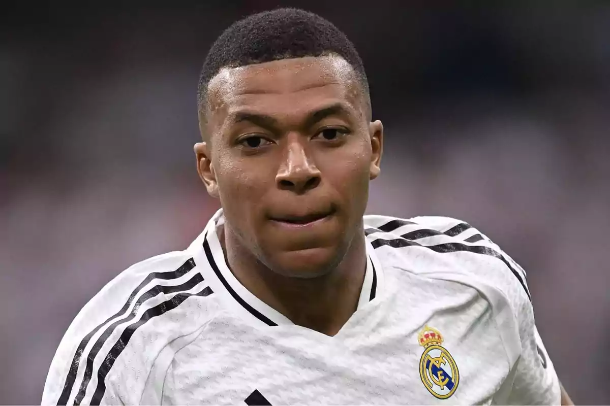 Soccer player wearing a white Real Madrid jersey during a match Soccer player wearing a white Real Madrid jersey during a match