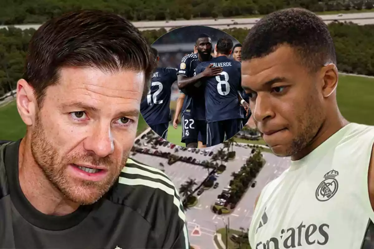 Dos hombres con ropa de entrenamiento del Real Madrid aparecen en primer plano, mientras al fondo se observa un grupo de jugadores celebrando en un campo de fútbol