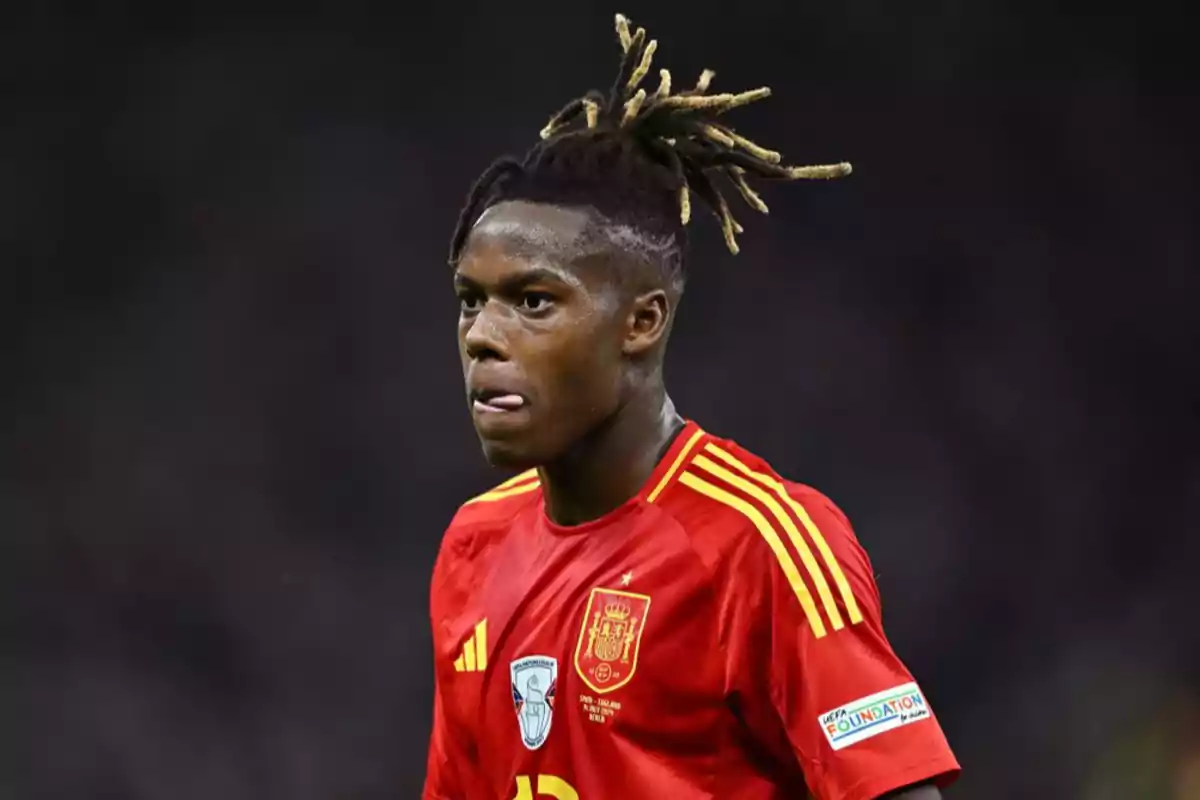 Soccer player wearing a red Spain national team jersey during a match Soccer player wearing a red Spain national team jersey during a match