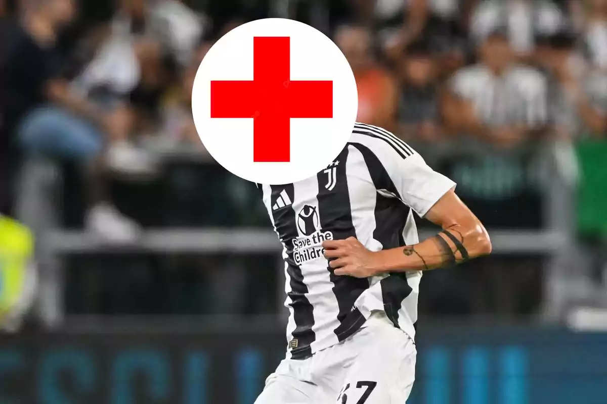 Soccer player in a Juventus uniform with a white circle and a red cross covering his face