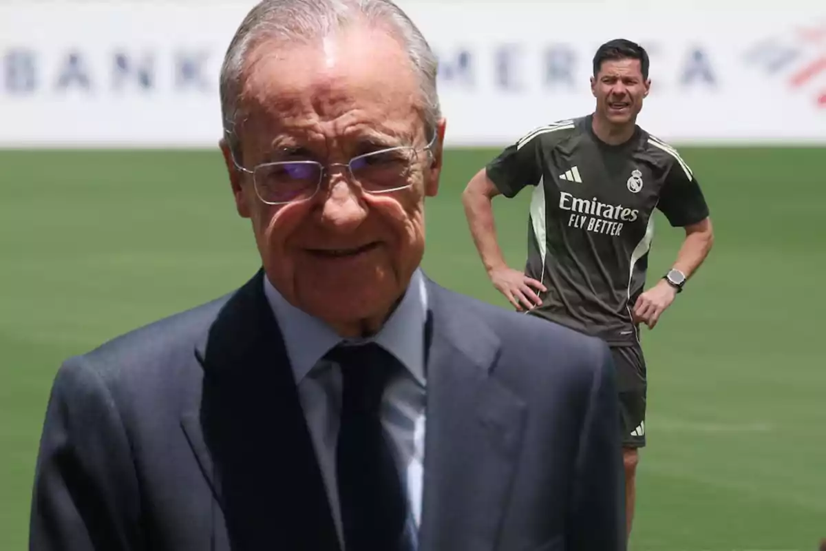 An older man with glasses and a dark suit in the foreground and a soccer coach in a Real Madrid training uniform in the background on a grass field.