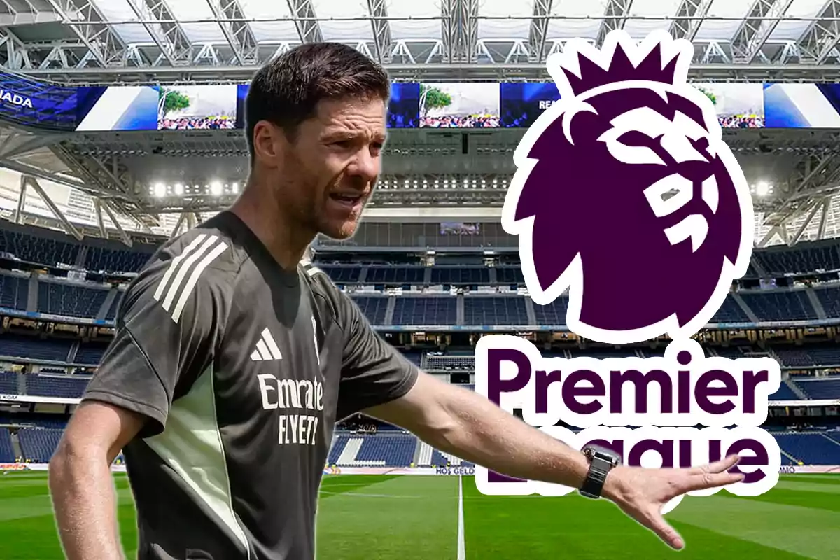 Soccer coach giving instructions in a stadium with the Premier League logo in the background
