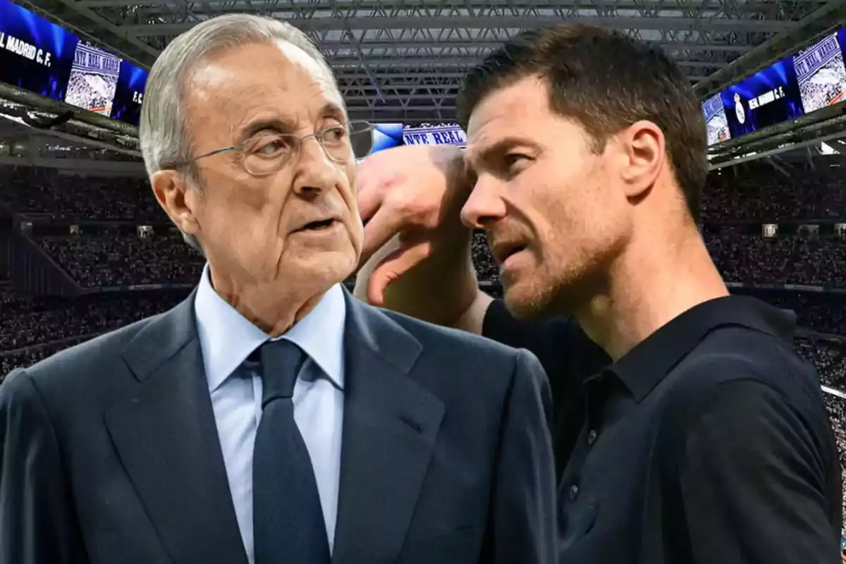 Two men talking in a soccer stadium full of spectators