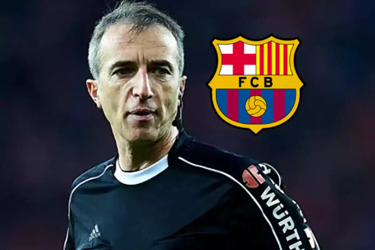 Soccer referee in a black uniform with the FC Barcelona crest in the background
