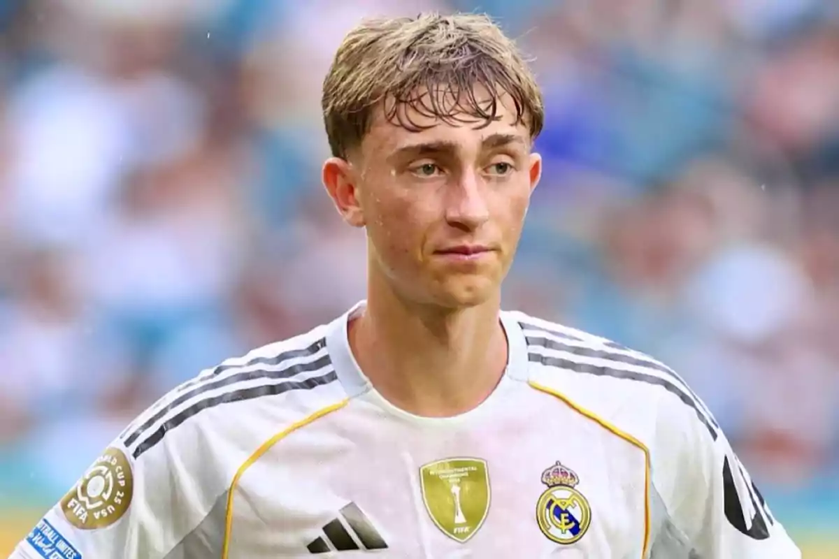 Young player wearing a white Real Madrid jersey during a match