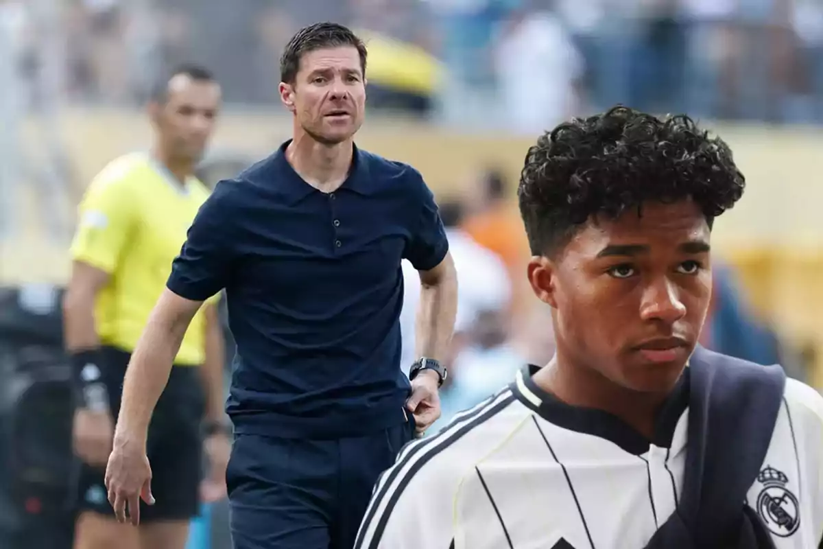 Entrenador de fútbol en el campo y un joven jugador con camiseta blanca y negra del Real Madrid en primer plano