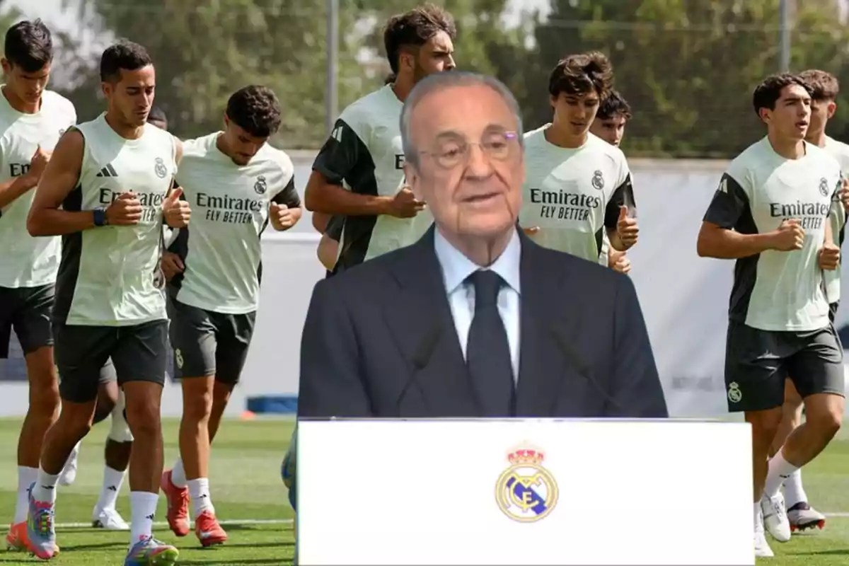 A group of Real Madrid players training while a man in a suit and glasses speaks in front of a podium with the club’s crest.
