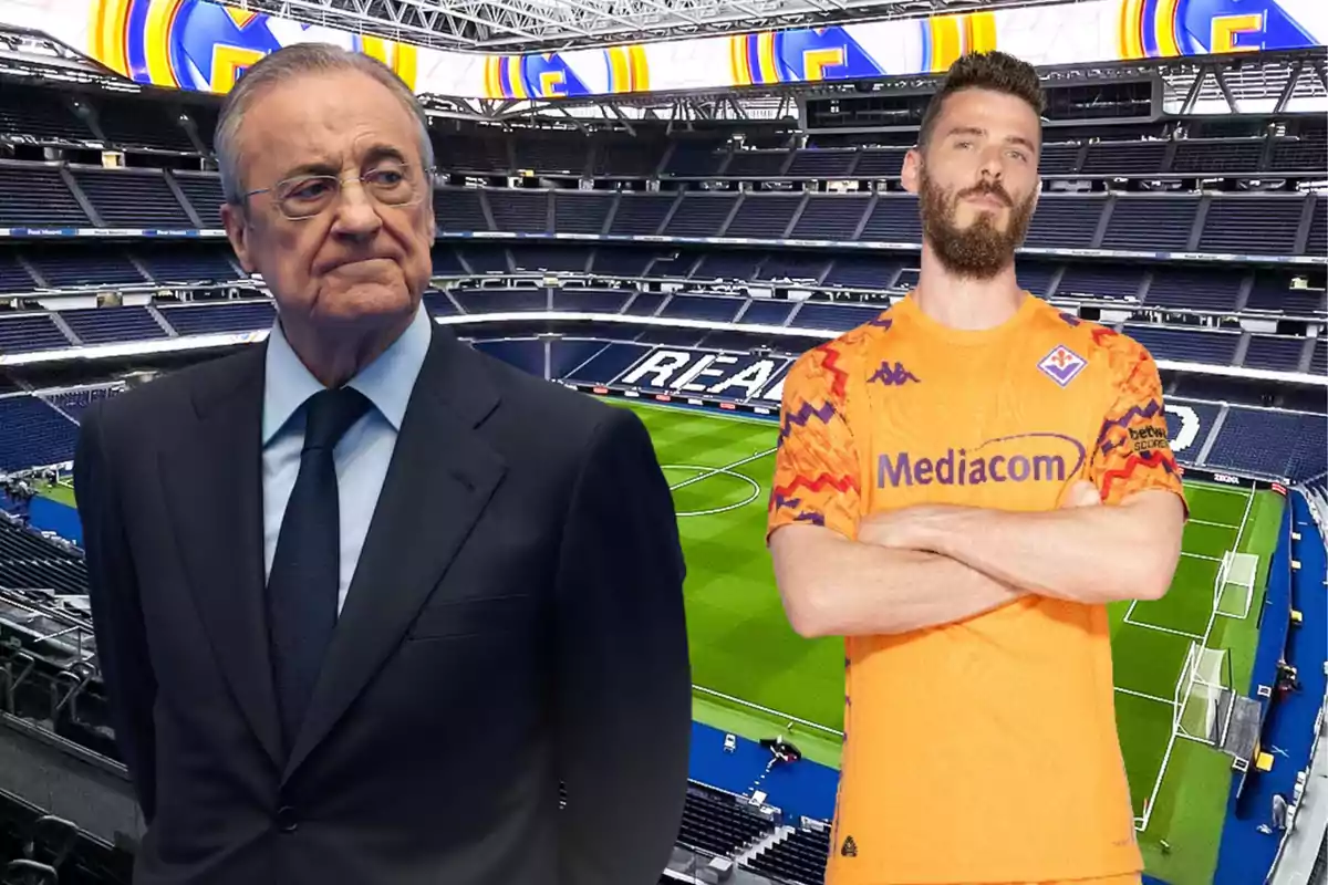 A man in a suit and another in a goalkeeper uniform pose in a modern soccer stadium with empty stands and the name Real visible in the seats.