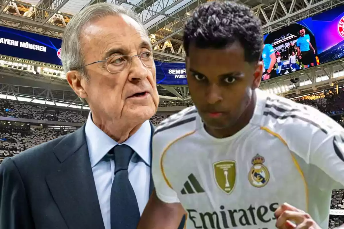 Un hombre de traje y un jugador de fútbol con uniforme blanco del Real Madrid aparecen en un estadio lleno de aficionados con pantallas gigantes al fondo.