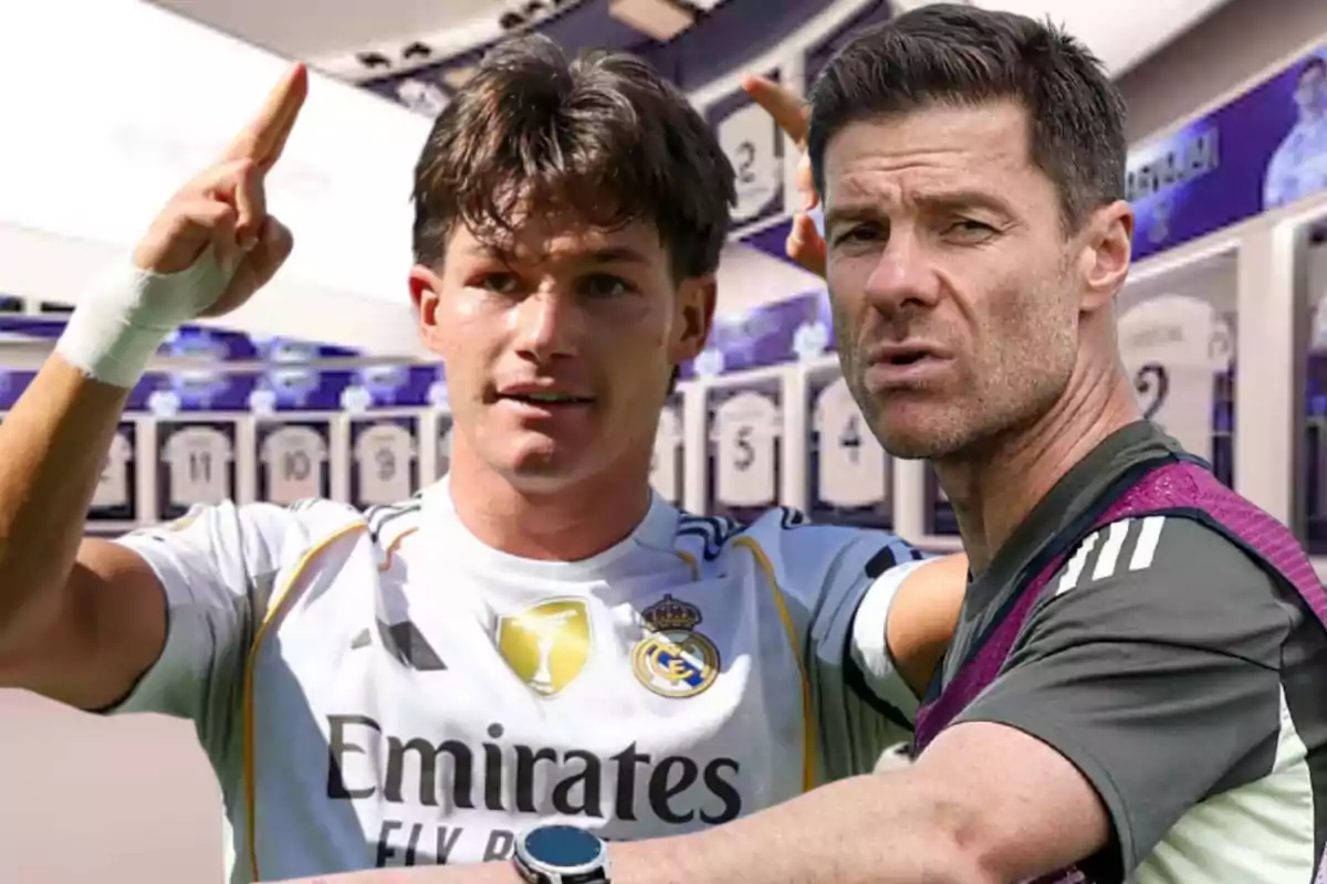 Two people in the foreground inside a football locker room, one wearing a Real Madrid uniform and the other dressed in sportswear.