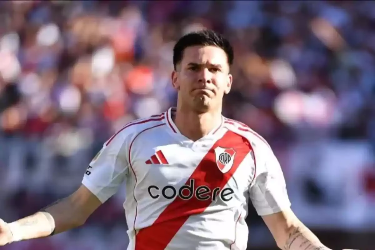 Soccer player wearing a River Plate uniform on the field during a match Soccer player wearing a River Plate uniform on the field during a match