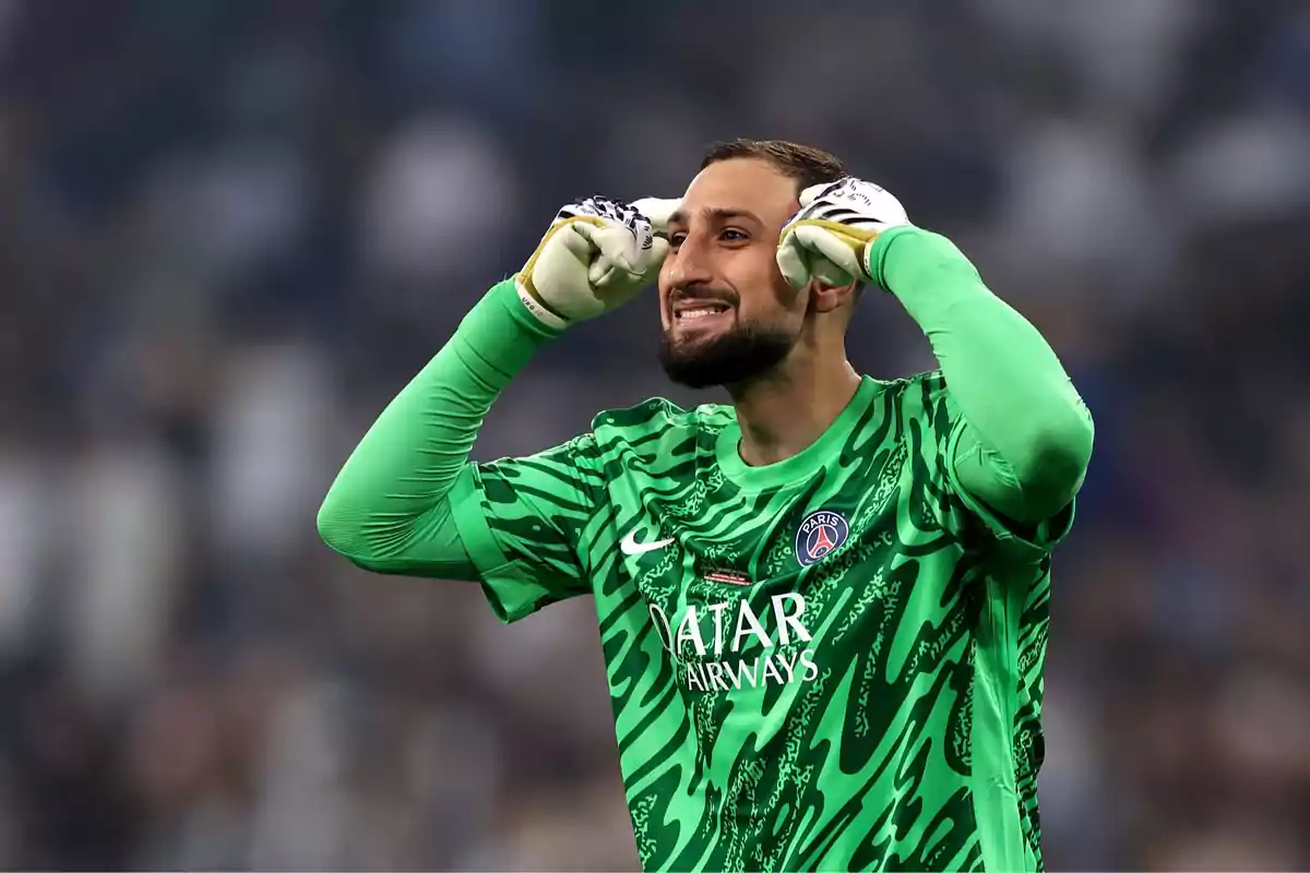 PSG goalkeeper in a green uniform celebrating on the field with his hands on his head and a smiling expression PSG goalkeeper in a green uniform celebrating on the field with his hands on his head and a smiling expression