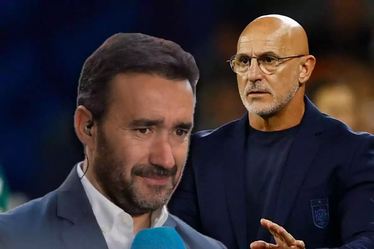 Two middle-aged men with serious expressions, one with dark hair and a beard holding a blue microphone and the other bald with glasses and a gray beard, both wearing dark jackets.