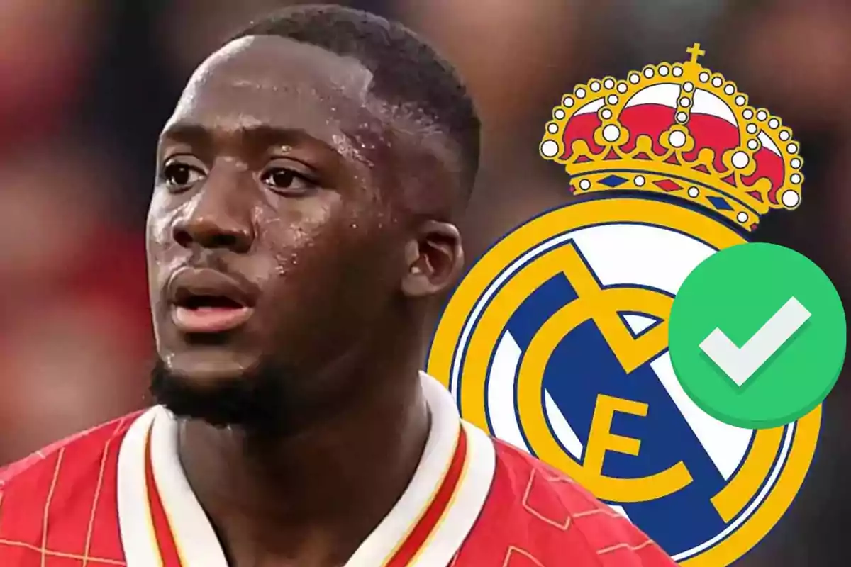 Soccer player wearing a red jersey in front of the Real Madrid crest and a green verification icon