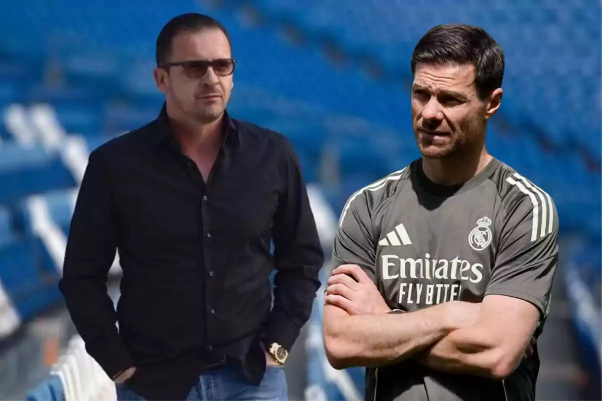Two men in a soccer stadium, one wearing a black jersey and sunglasses and the other wearing a Real Madrid sports jersey.