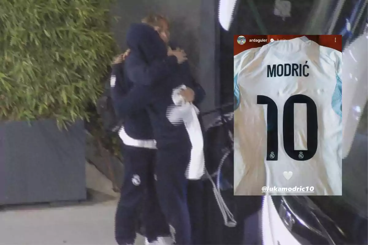 Two people dressed in dark sportswear are hugging next to a plant and a suitcase; in the upper right corner, there is a white soccer jersey with the name Modric and the number 10.