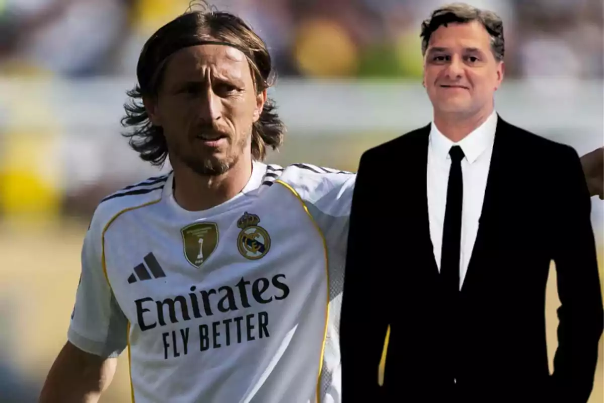 A player wearing a Real Madrid uniform is standing next to a man dressed in a black suit and tie in an outdoor setting.