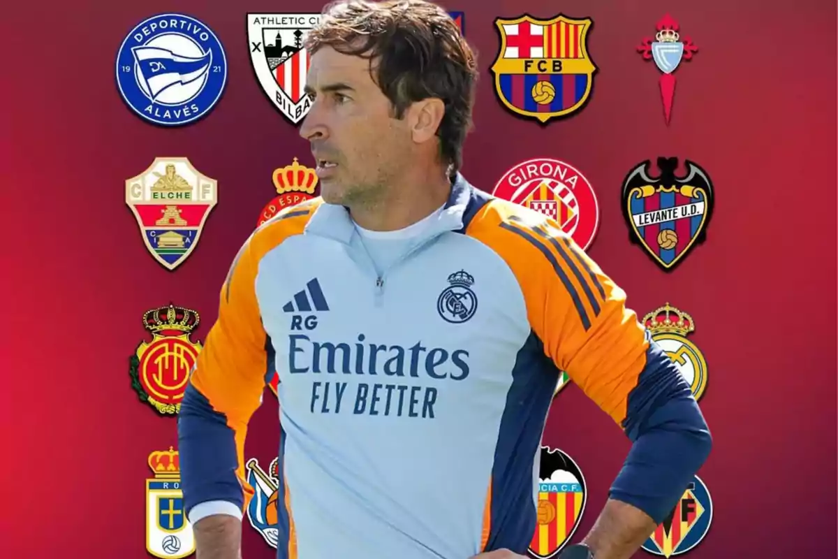 Real Madrid coach in training uniform posing in front of a red background with crests of various Spanish football teams