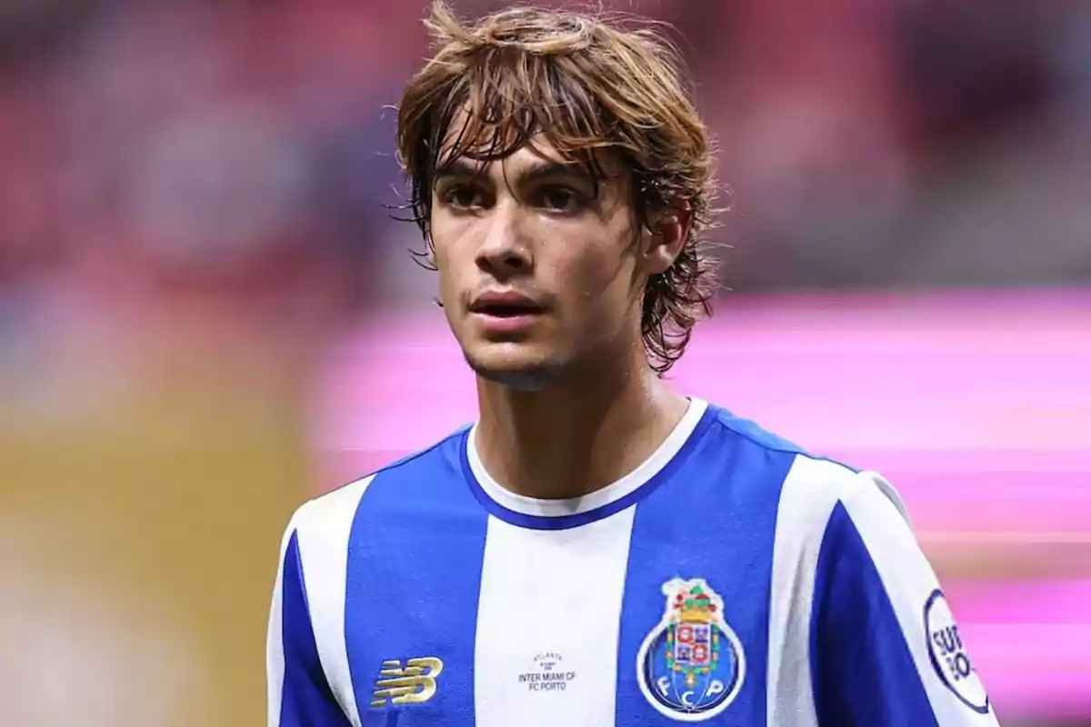 Soccer player wearing a blue and white FC Porto jersey in a stadium Soccer player wearing a blue and white FC Porto jersey in a stadium
