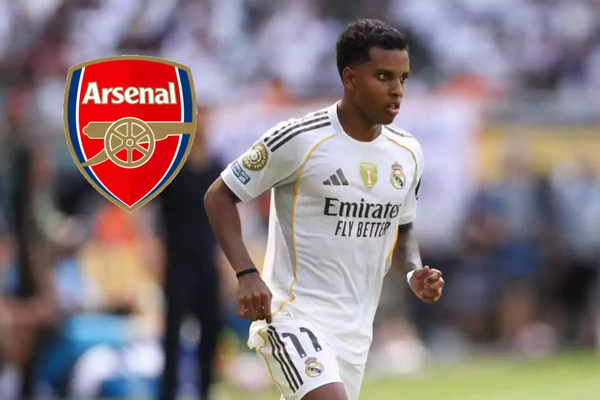 Real Madrid player running on the field with the Arsenal crest next to him