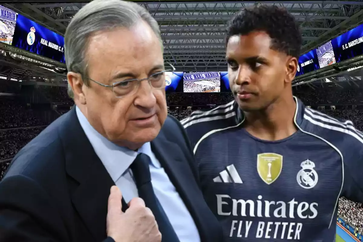 Dos personas en un estadio de fútbol, una con traje y otra con uniforme del Real Madrid, con pantallas y público de fondo
