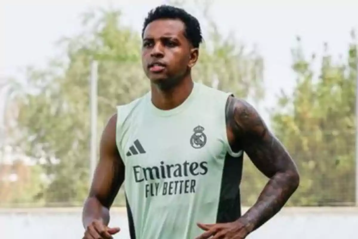 Soccer player training in a sleeveless Real Madrid jersey on an outdoor field Soccer player training in a sleeveless Real Madrid jersey on an outdoor field