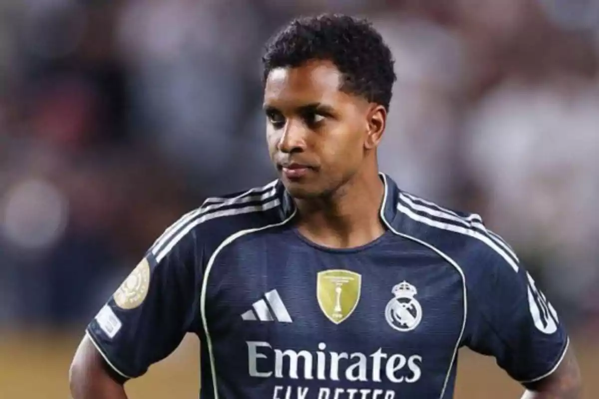 Soccer player wearing a navy blue Real Madrid uniform on the field during a match