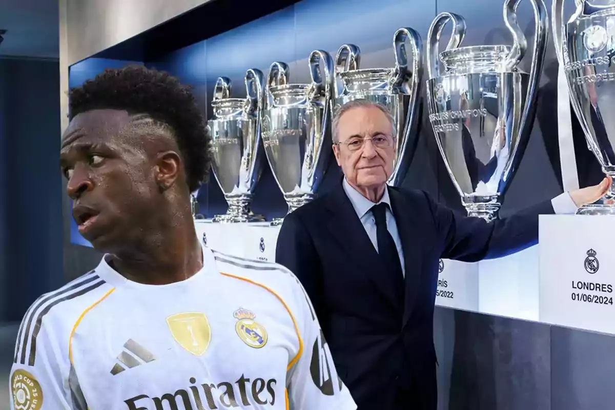 Un jugador del Real Madrid y un hombre de traje posan frente a varios trofeos de la Champions League exhibidos en una vitrina