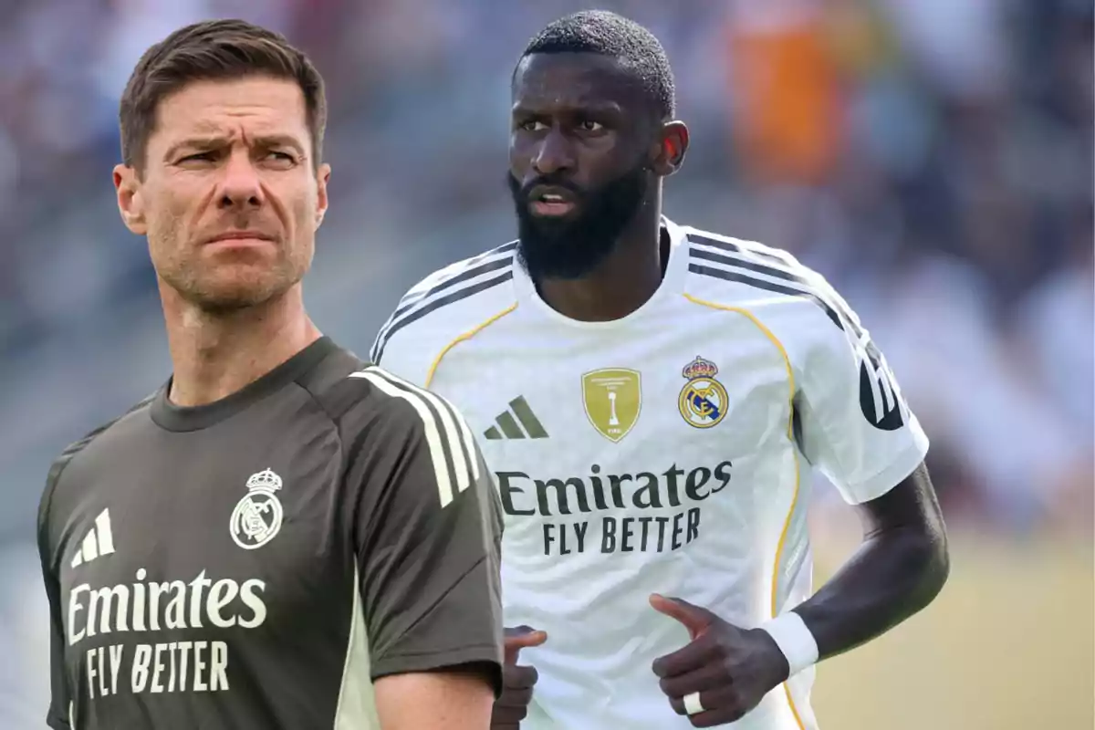 Two people wearing Real Madrid uniforms, one in the foreground with a training jersey and another in the background with a game jersey in a stadium.
