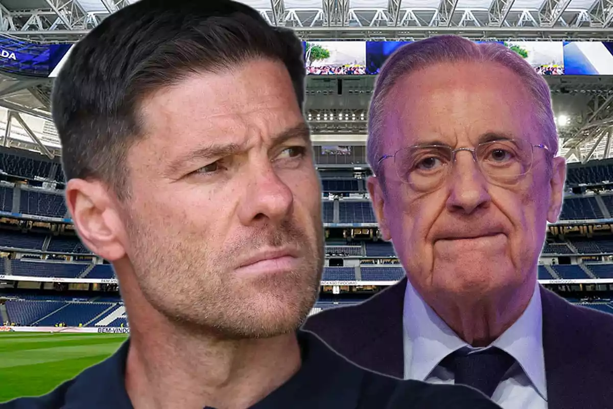 Dos hombres con expresión seria en el interior de un estadio de fútbol moderno
