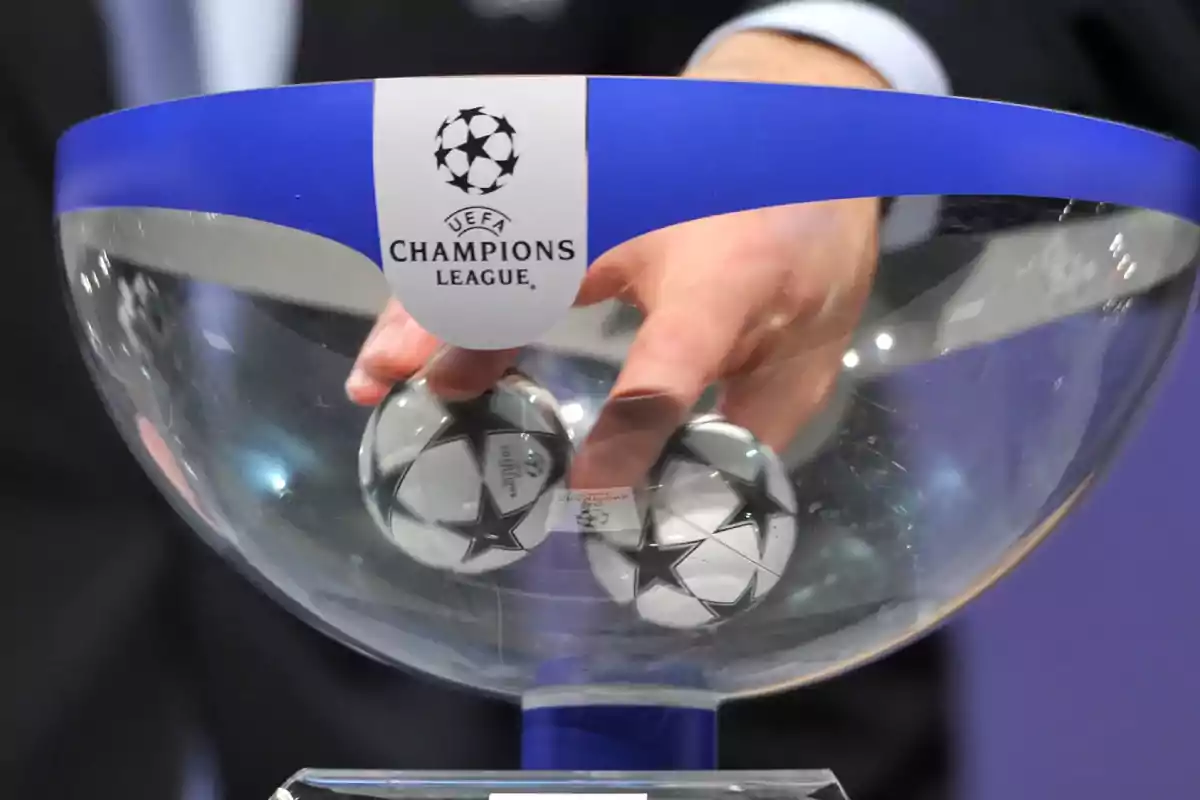 Hand drawing balls in the UEFA Champions League draw Hand drawing balls in the UEFA Champions League draw