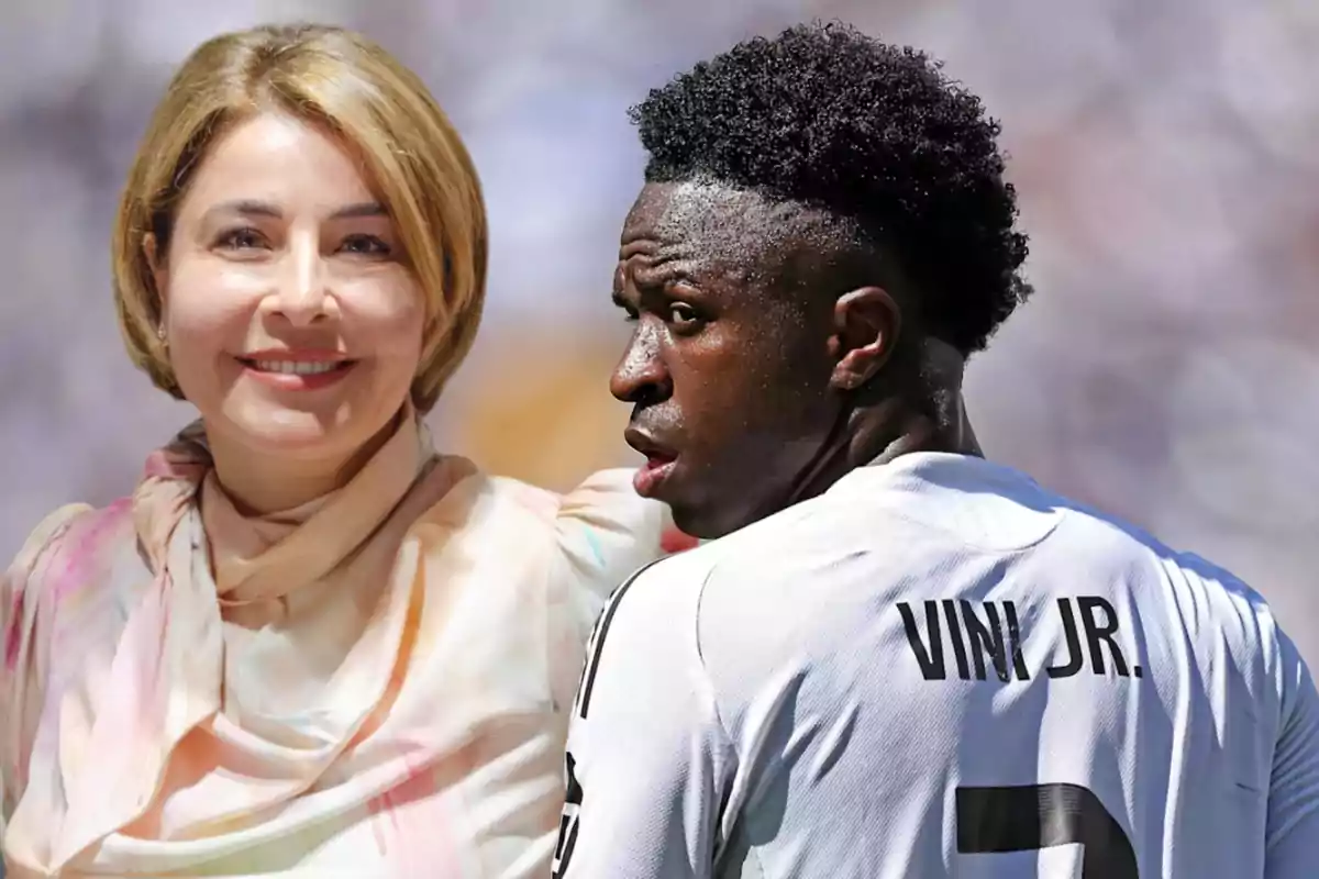 A smiling woman with short blonde hair and a man wearing a white sports jersey with the name Vini Jr. on the back