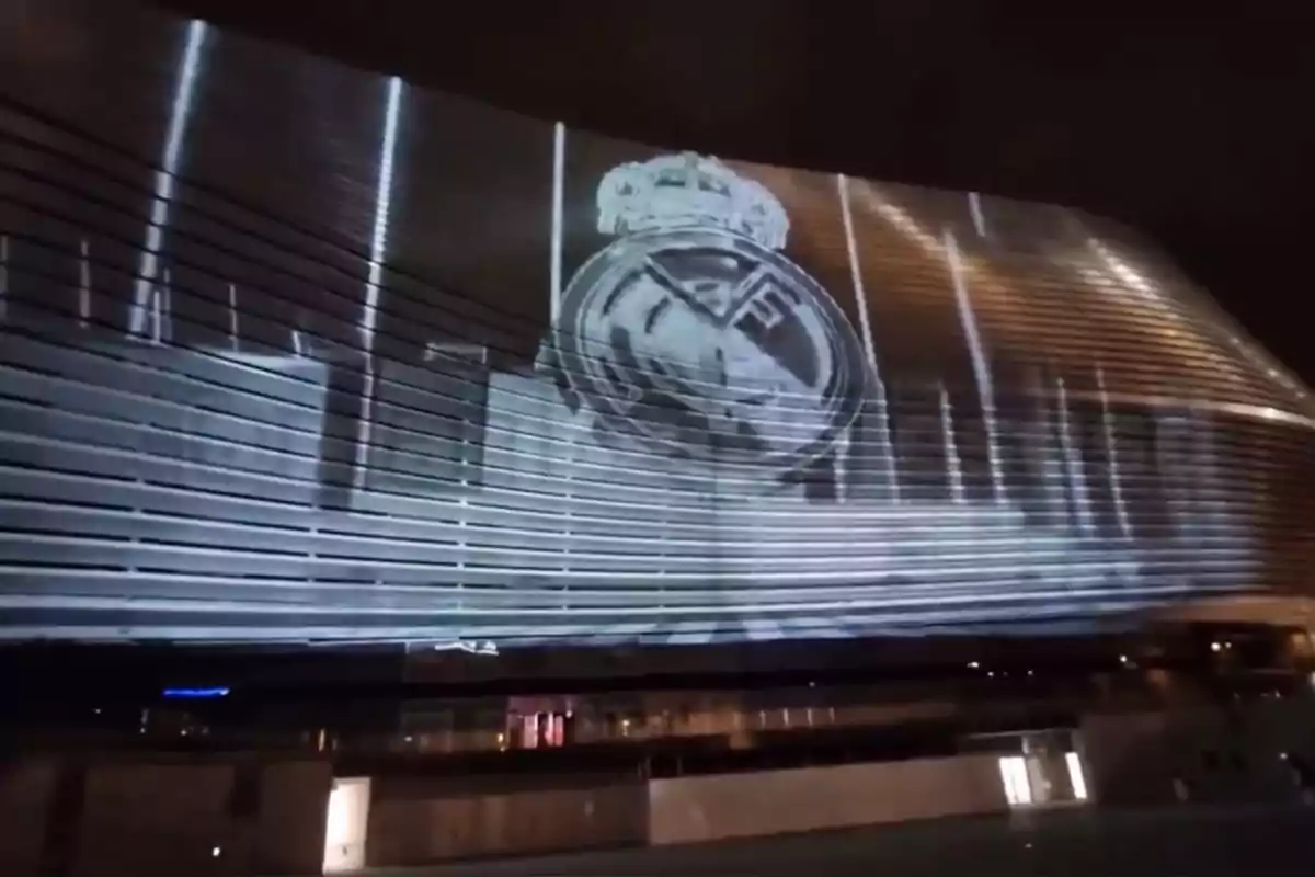 Projection of the Real Madrid crest on the façade of Santiago Bernabéu stadium at night