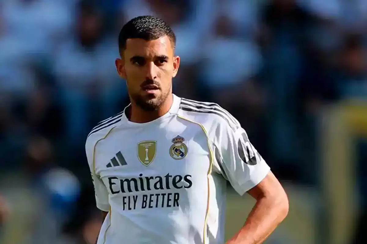 Soccer player in a white Real Madrid uniform during a match Soccer player in a white Real Madrid uniform during a match