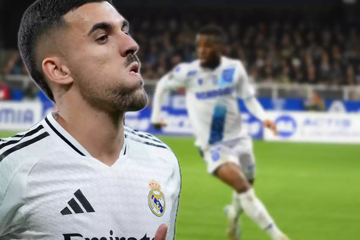 Real Madrid player in the foreground with a serious expression while a blurred opposing footballer is seen in the background at a soccer stadium