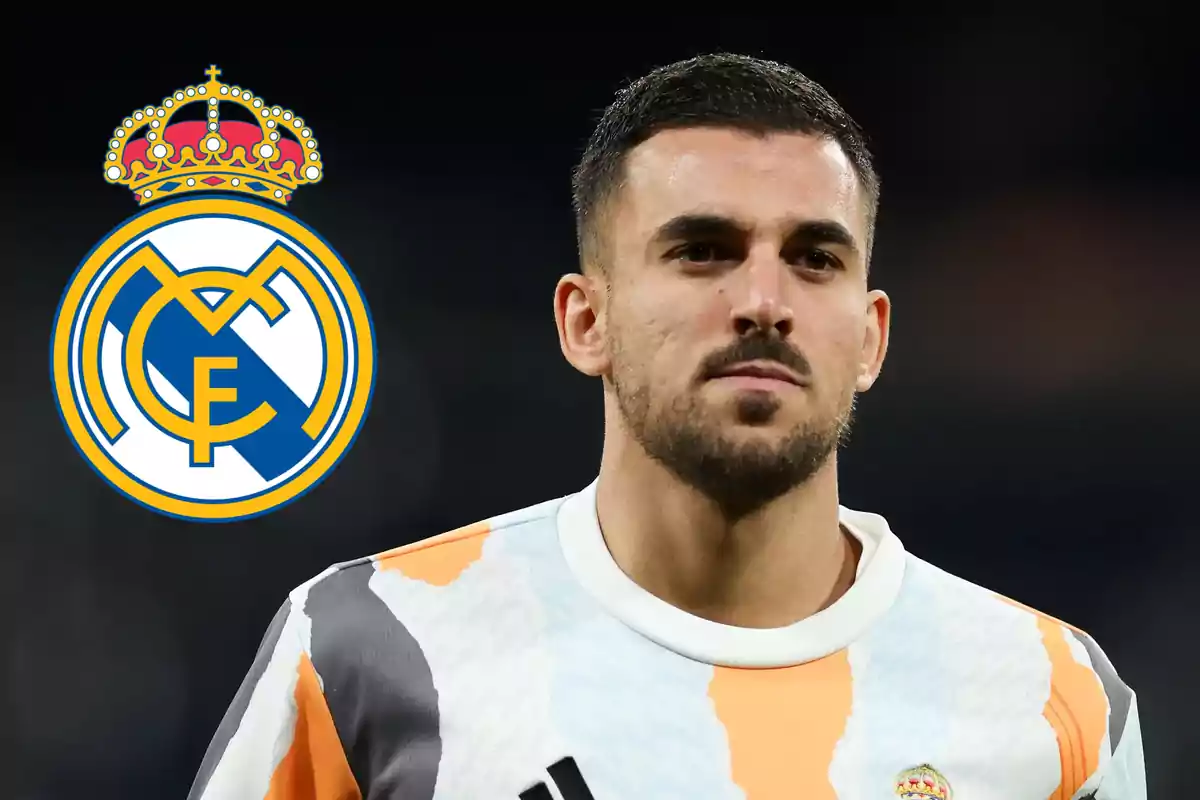 Soccer player in training uniform with the Real Madrid crest in the background