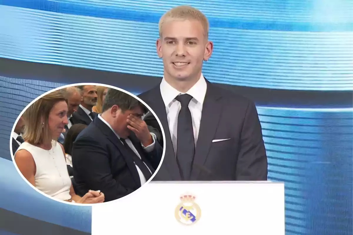 Un joven de cabello rubio y traje oscuro sonríe mientras da un discurso en un podio con el escudo del Real Madrid, en la esquina se muestra un recuadro con dos personas emocionadas entre el público, una mujer y un hombre visiblemente conmovidos.