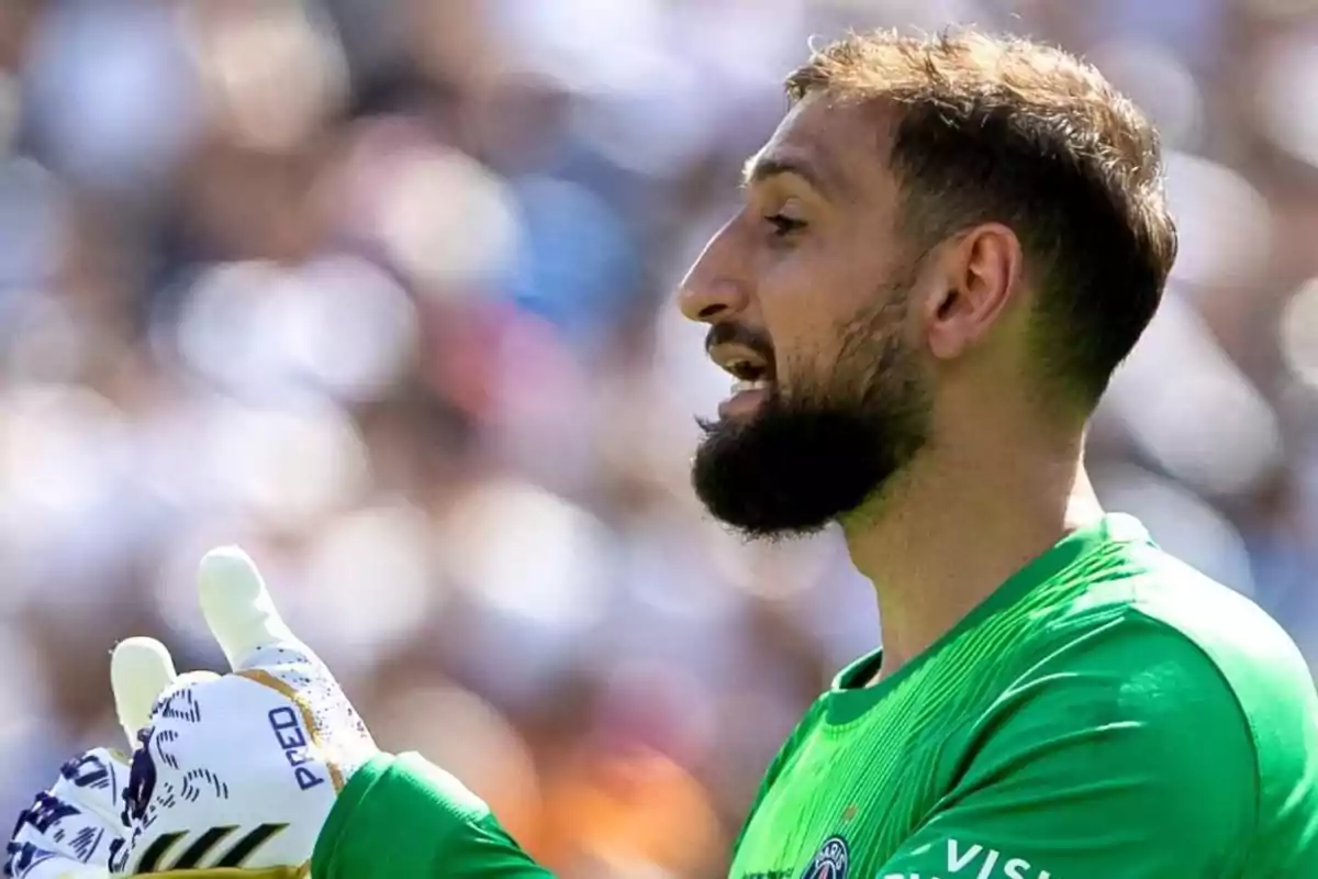 Soccer goalkeeper wearing gloves and a green uniform giving instructions during a match Soccer goalkeeper wearing gloves and a green uniform giving instructions during a match