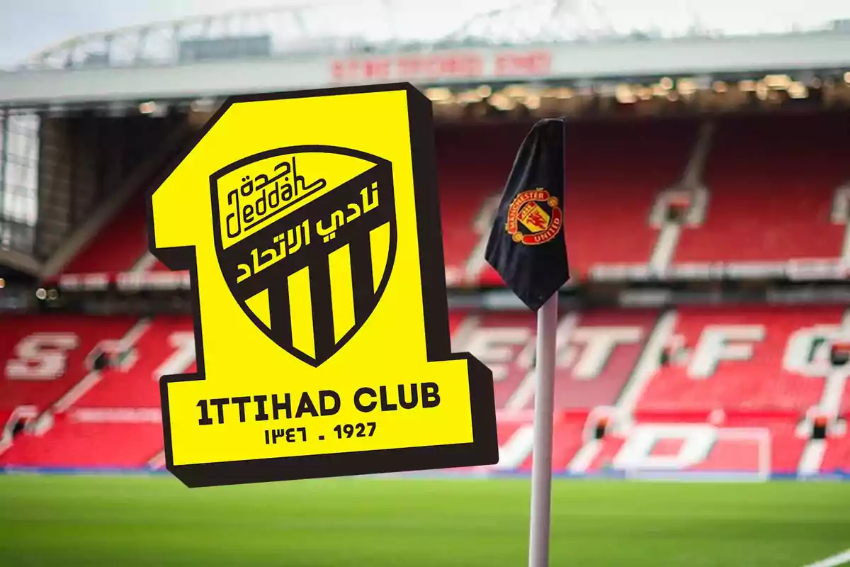 Yellow and black Ittihad Club crest in front of a corner flag with the Manchester United logo in a football stadium