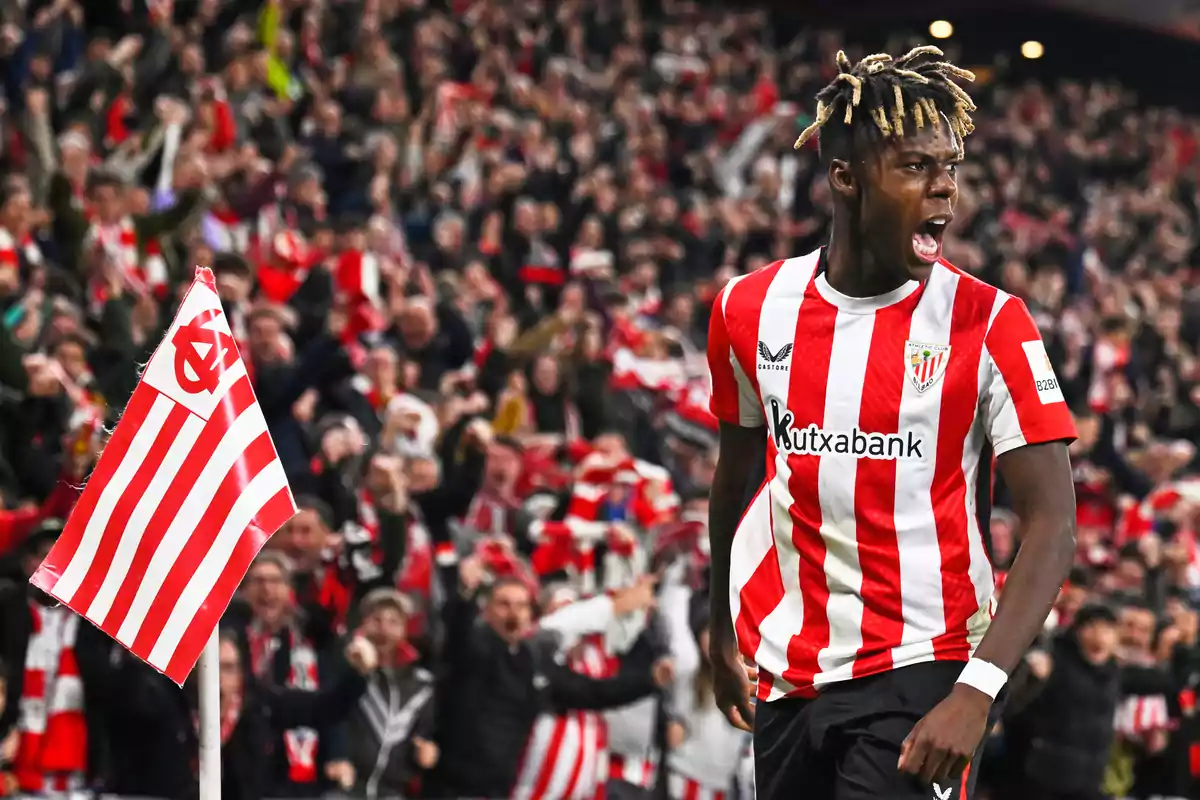 Athletic Club player celebrating a goal in front of the fans in a packed stadium Athletic Club player celebrating a goal in front of the fans in a packed stadium