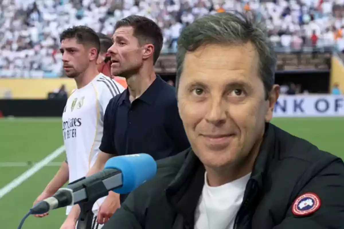A smiling man in front of a microphone with a soccer stadium and two people in the background