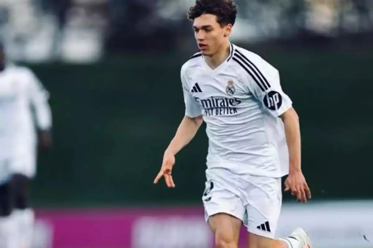 Young player in a white Real Madrid uniform running on the field during a match Young player in a white Real Madrid uniform running on the field during a match