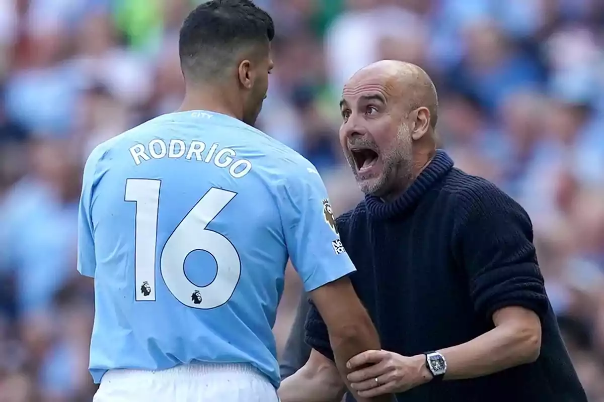 Soccer coach giving energetic instructions to a player wearing the number 16 jersey during a match Soccer coach giving energetic instructions to a player wearing the number 16 jersey during a match